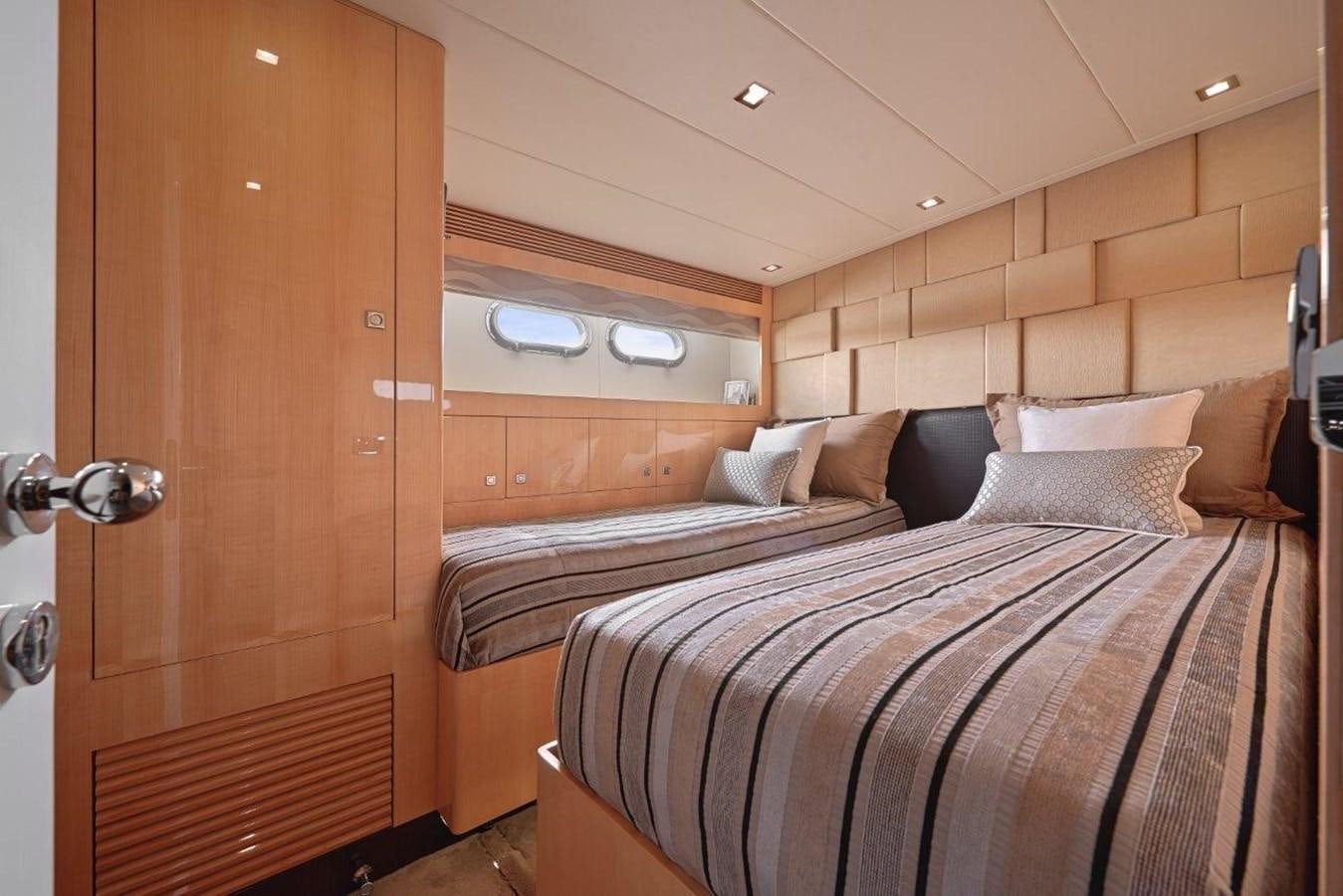 a room with a bed and a wood door aboard E84 (NEW BOAT SPEC)  Yacht for Sale