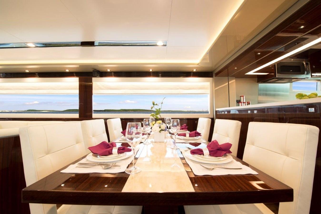 a table with plates and glasses on it aboard E84 (NEW BOAT SPEC)  Yacht for Sale