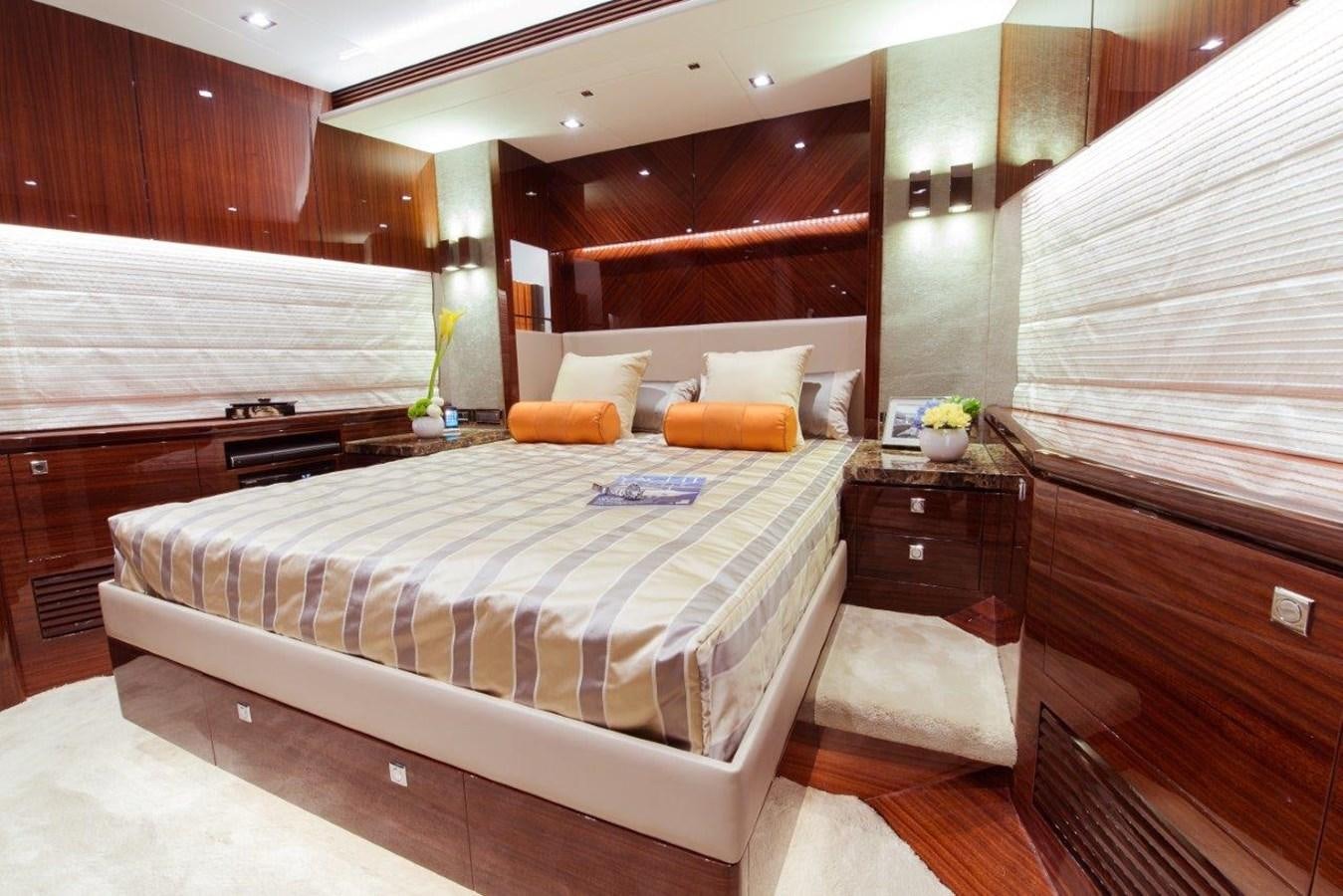a bedroom with a bed and a dresser aboard E84 (NEW BOAT SPEC)  Yacht for Sale