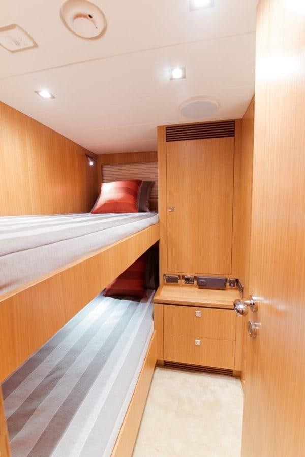a room with a bed and a closet aboard E84 (NEW BOAT SPEC)  Yacht for Sale