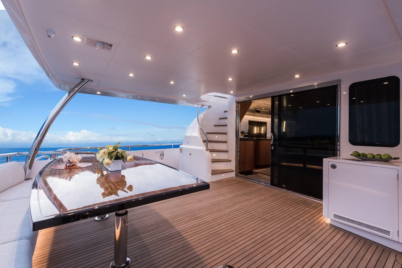 a large room with a table and chairs and a large window aboard E84 (NEW BOAT SPEC)  Yacht for Sale
