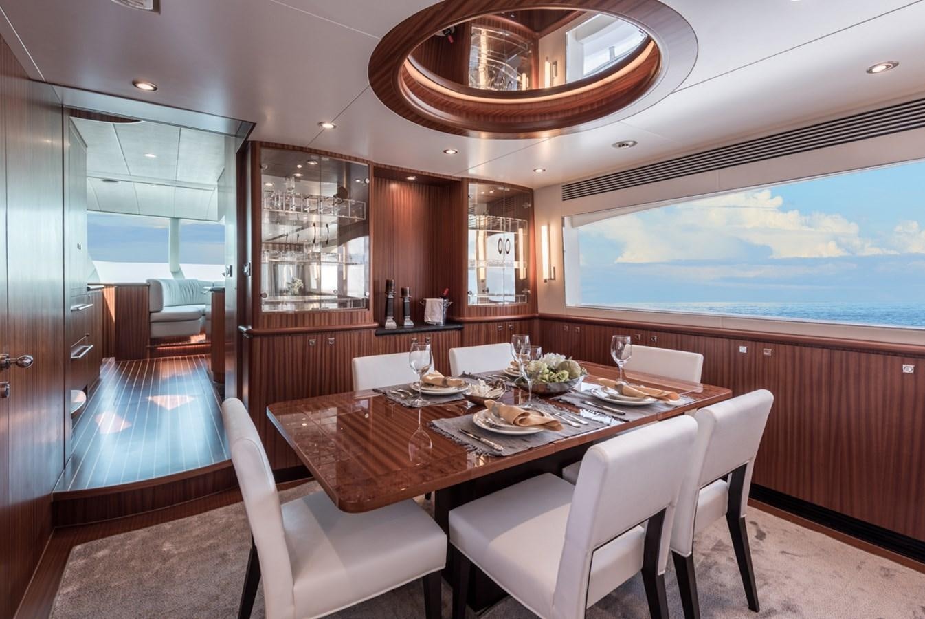 a dining room with a large window aboard E84 (NEW BOAT SPEC)  Yacht for Sale
