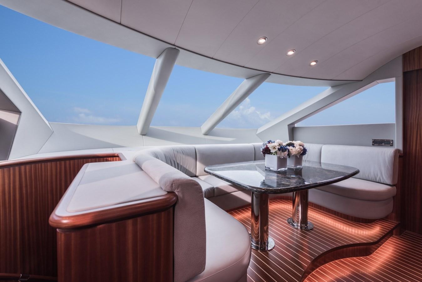 a room with a table and chairs aboard E84 (NEW BOAT SPEC)  Yacht for Sale