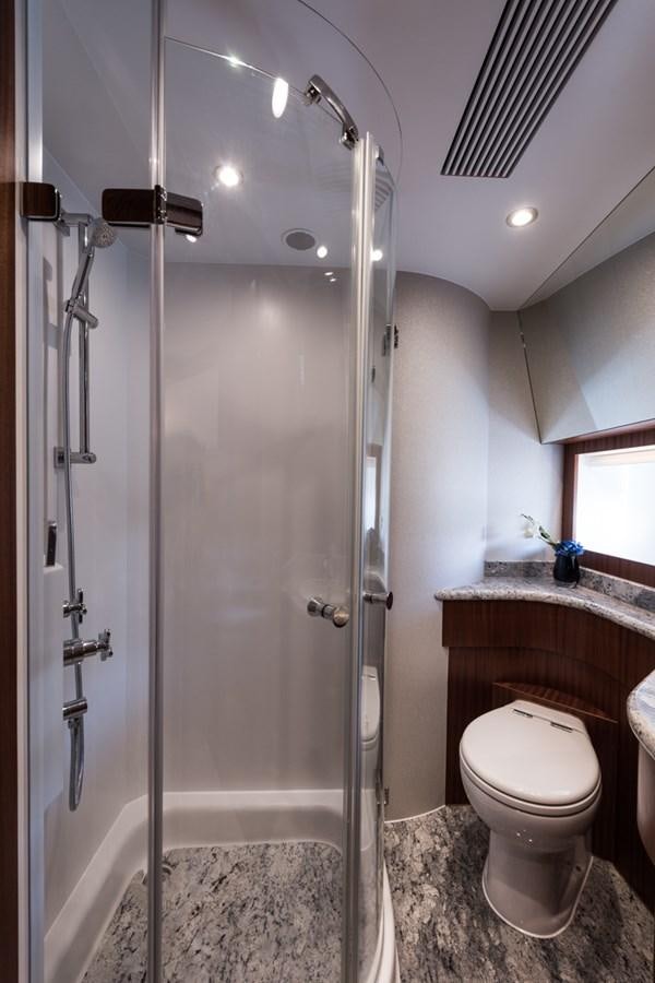 a bathroom with a shower unit and a toilet aboard E84 (NEW BOAT SPEC)  Yacht for Sale