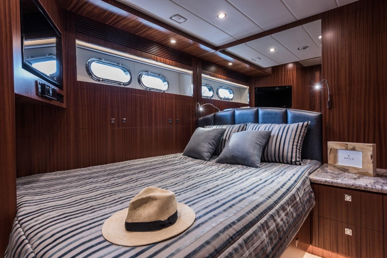 a bed with a hat on it aboard E84 (NEW BOAT SPEC)  Yacht for Sale