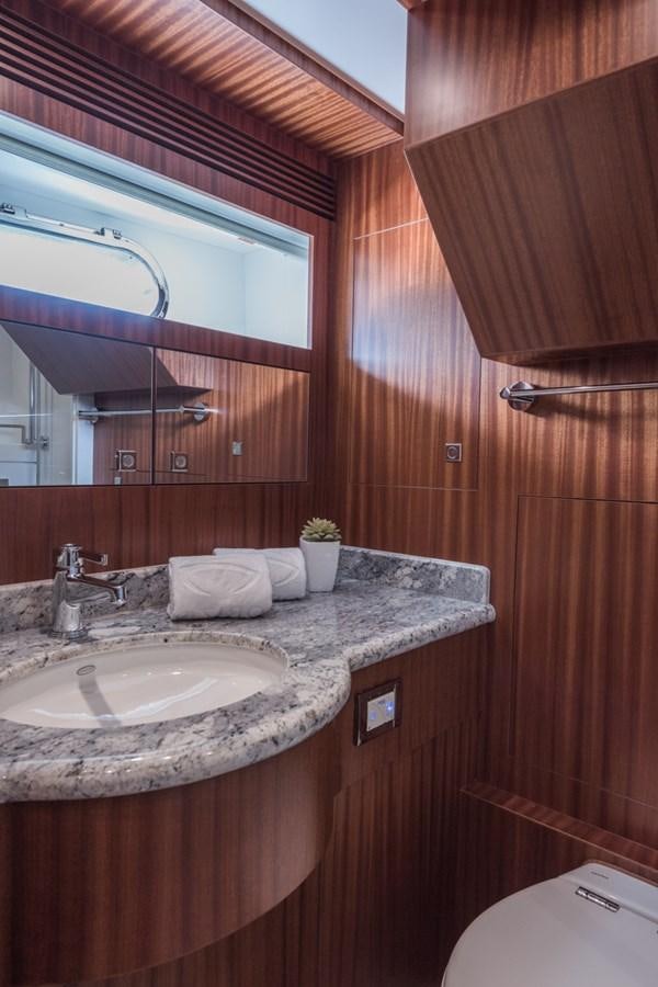 a bathroom with a sink and a mirror aboard E84 (NEW BOAT SPEC)  Yacht for Sale