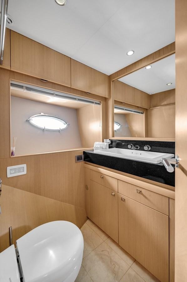 a bathroom with a toilet and a sink aboard PRINCESS 85 MY Yacht for Sale