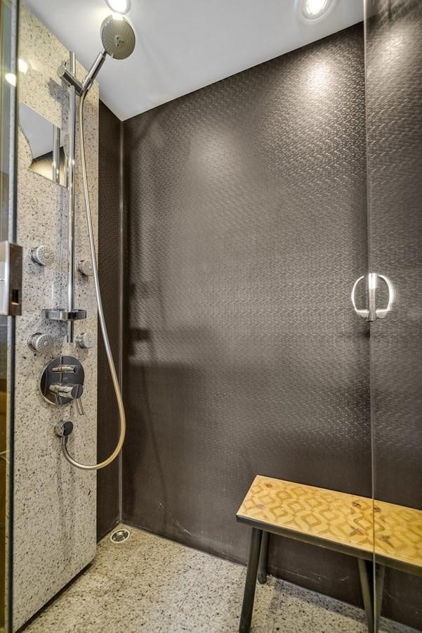 a shower with a metal wall aboard PRINCESS 85 MY Yacht for Sale
