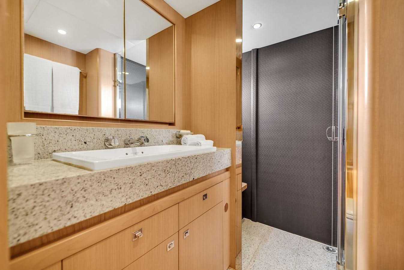 a bathroom with a large mirror aboard PRINCESS 85 MY Yacht for Sale
