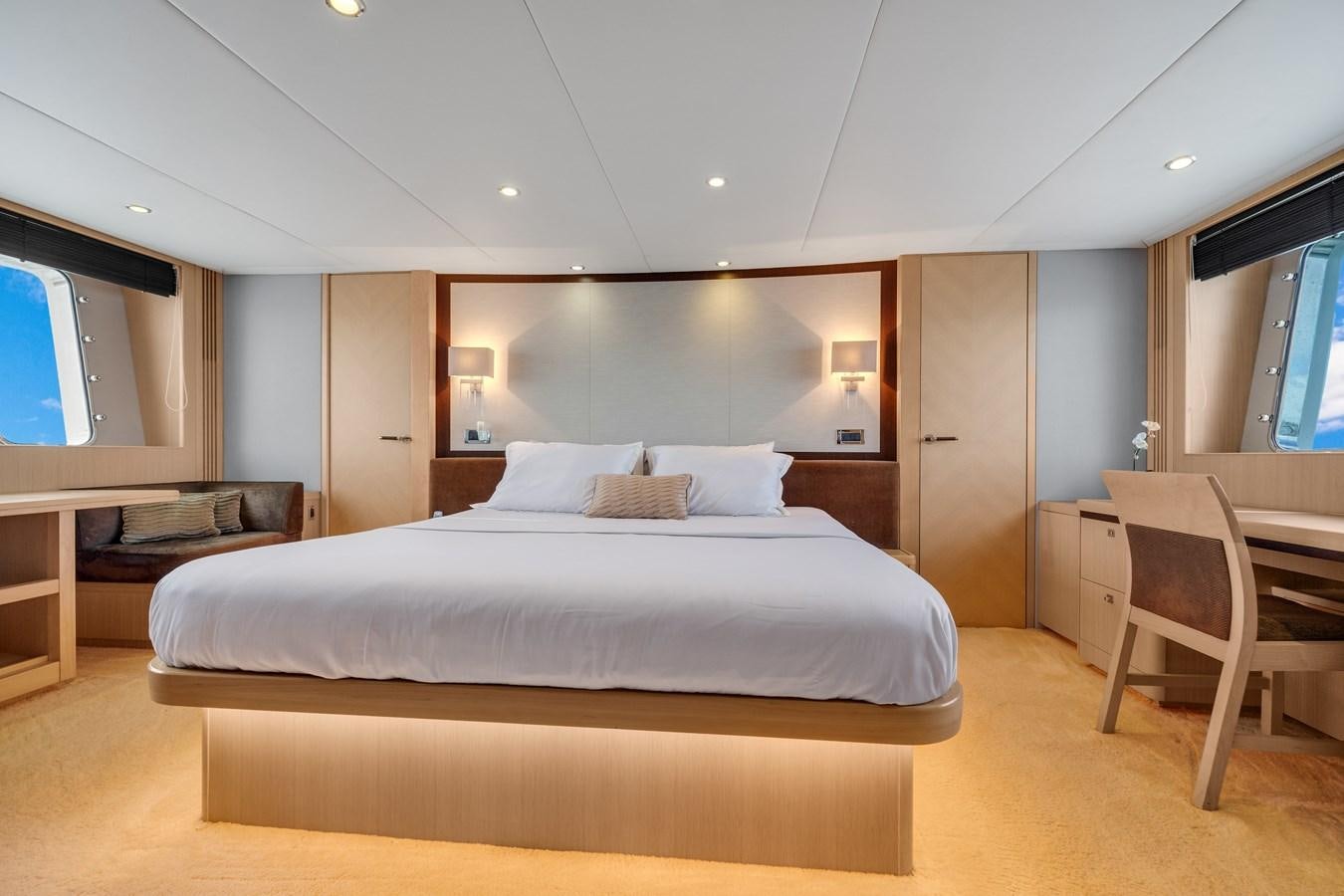 a large bedroom with a large bed aboard PRINCESS 85 MY Yacht for Sale