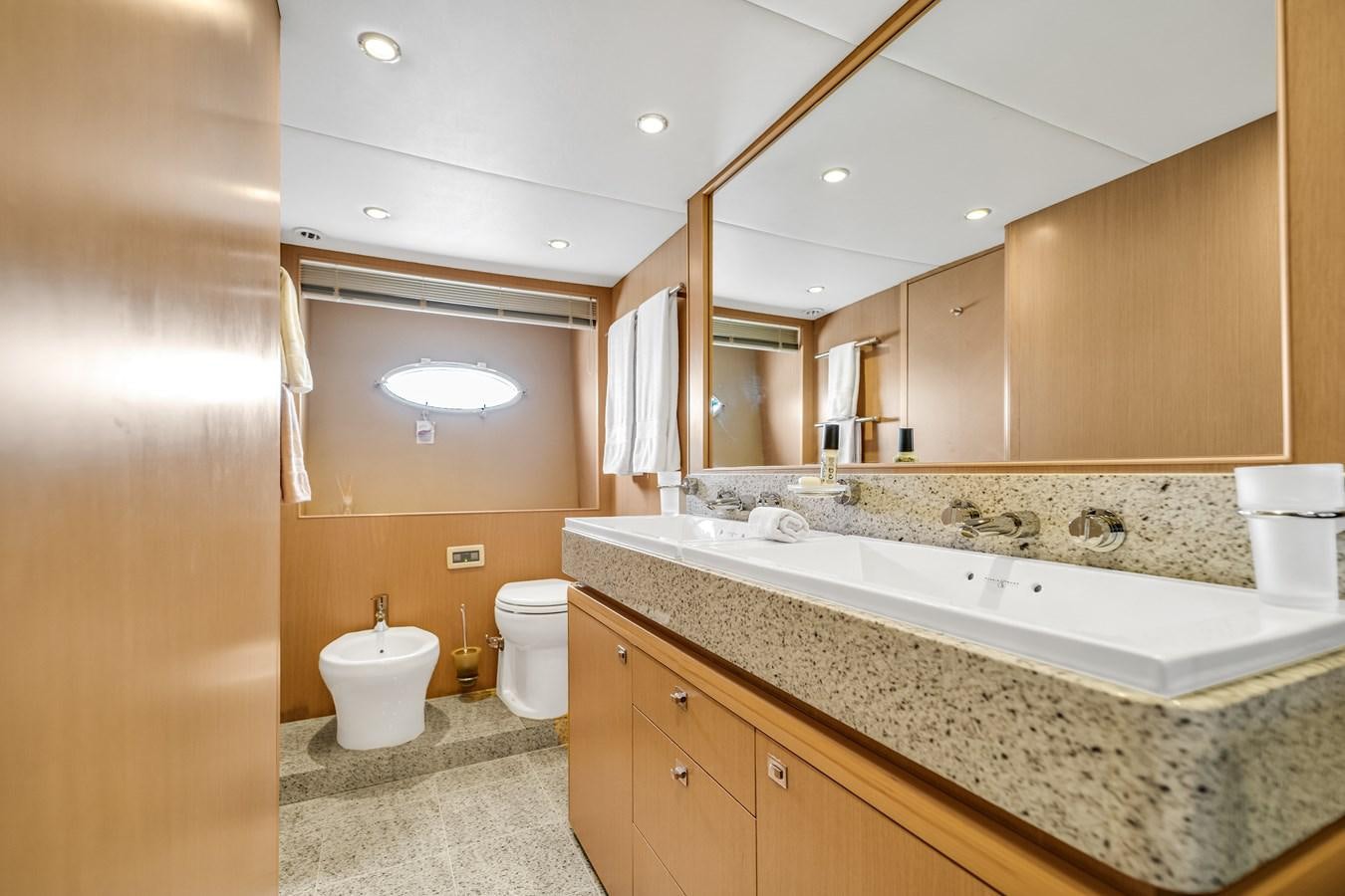 a bathroom with a large mirror aboard PRINCESS 85 MY Yacht for Sale