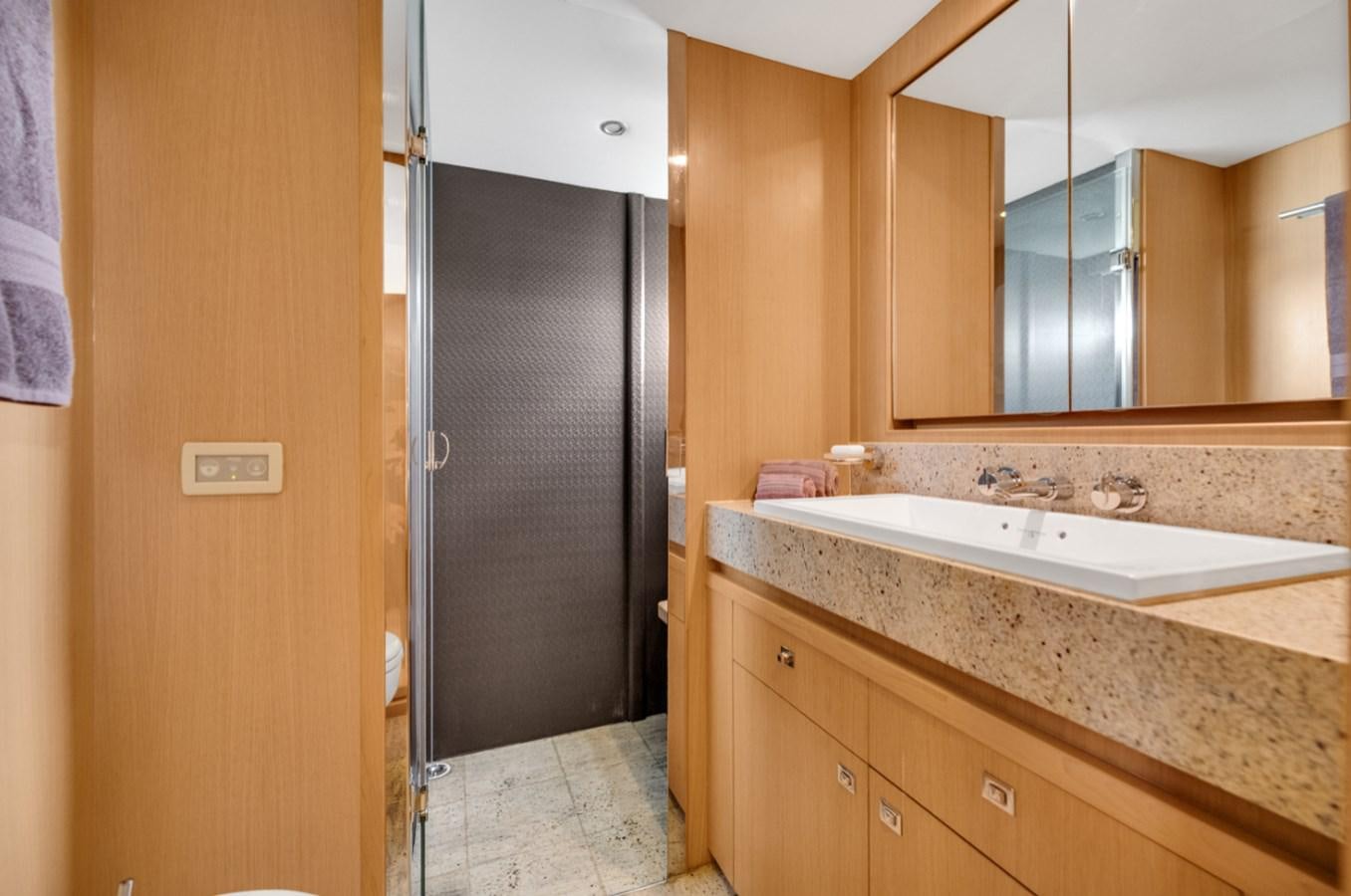a bathroom with a black door aboard PRINCESS 85 MY Yacht for Sale