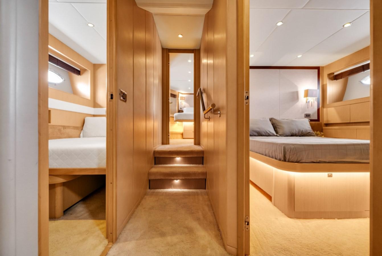 a room with a bed and a door aboard PRINCESS 85 MY Yacht for Sale