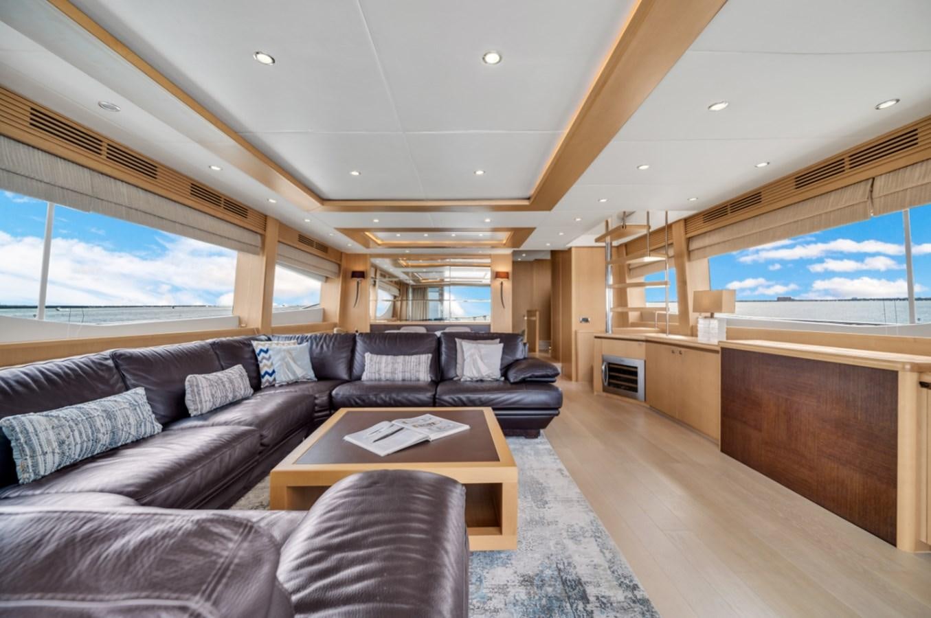 a living room with a large window aboard PRINCESS 85 MY Yacht for Sale