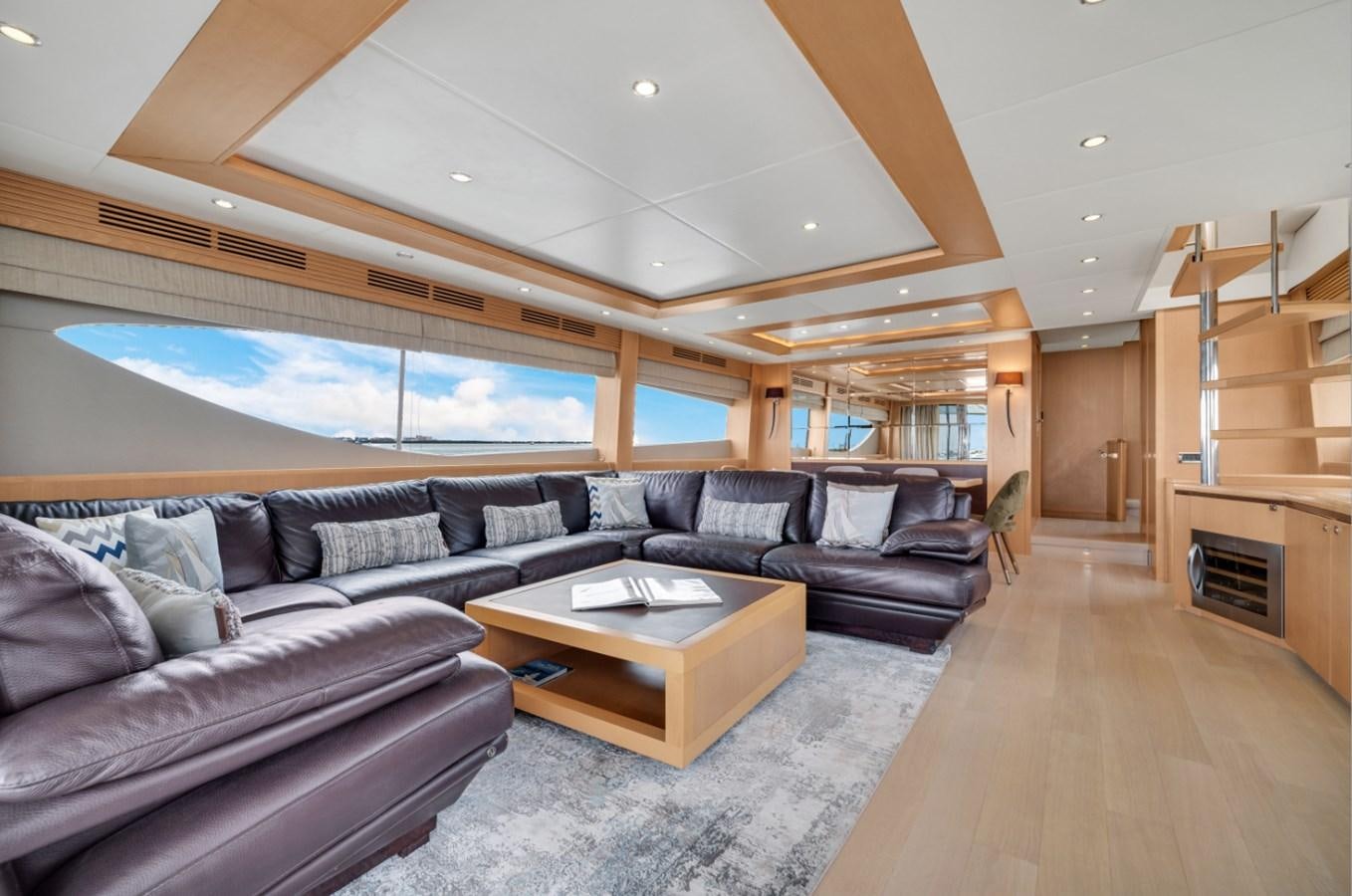 a living room with leather couches aboard PRINCESS 85 MY Yacht for Sale