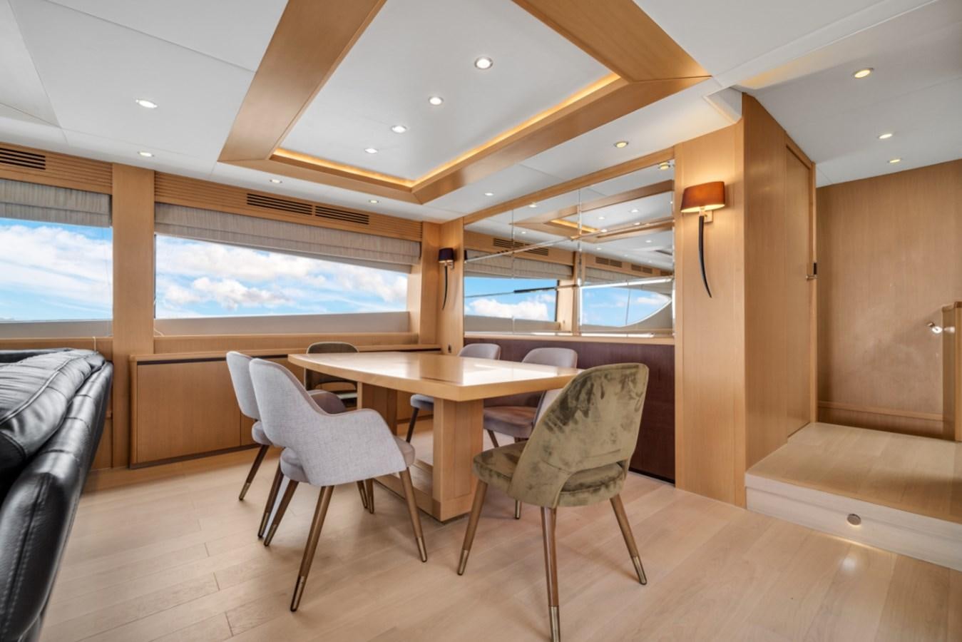 a room with a table and chairs aboard PRINCESS 85 MY Yacht for Sale