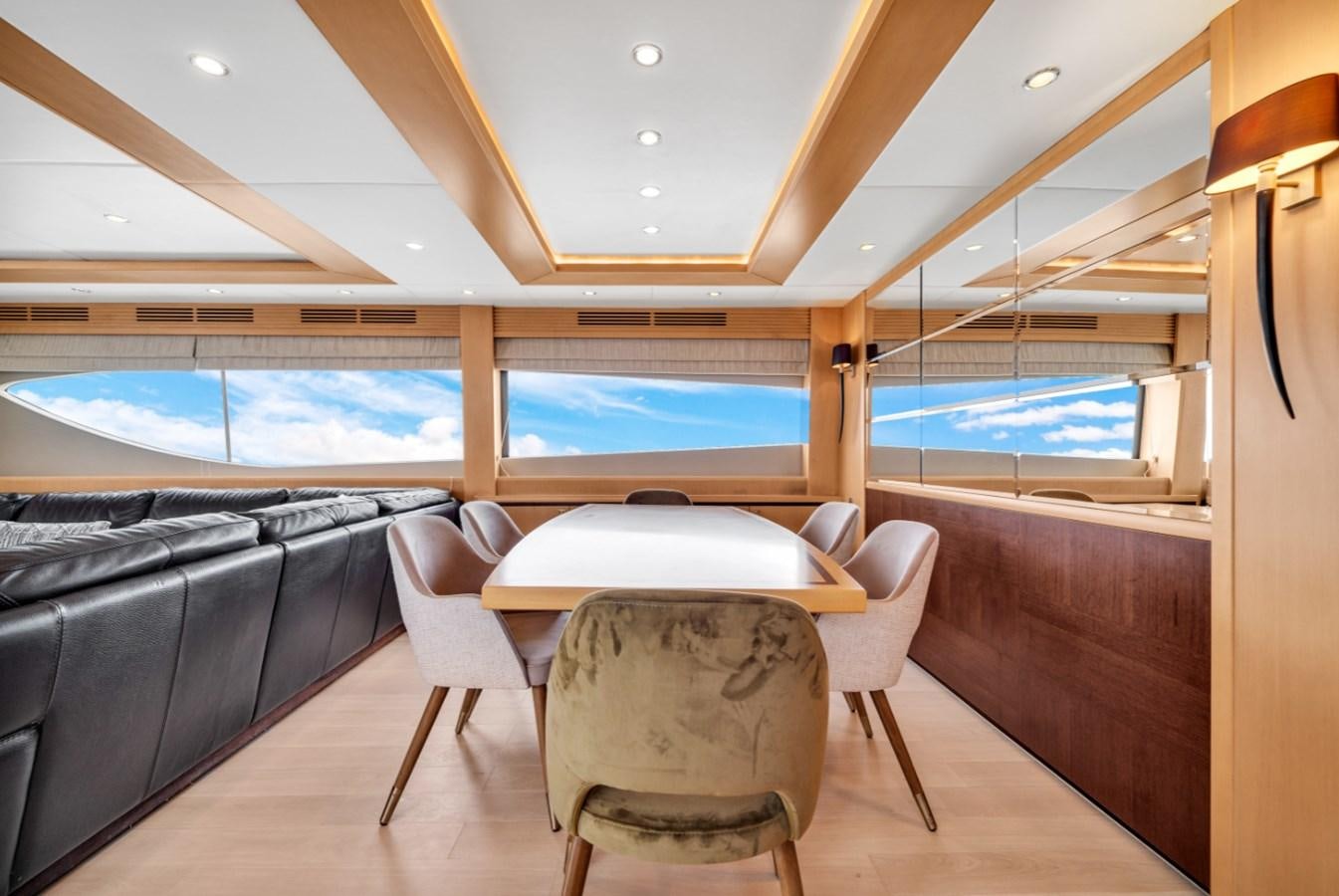a room with a table and chairs aboard PRINCESS 85 MY Yacht for Sale