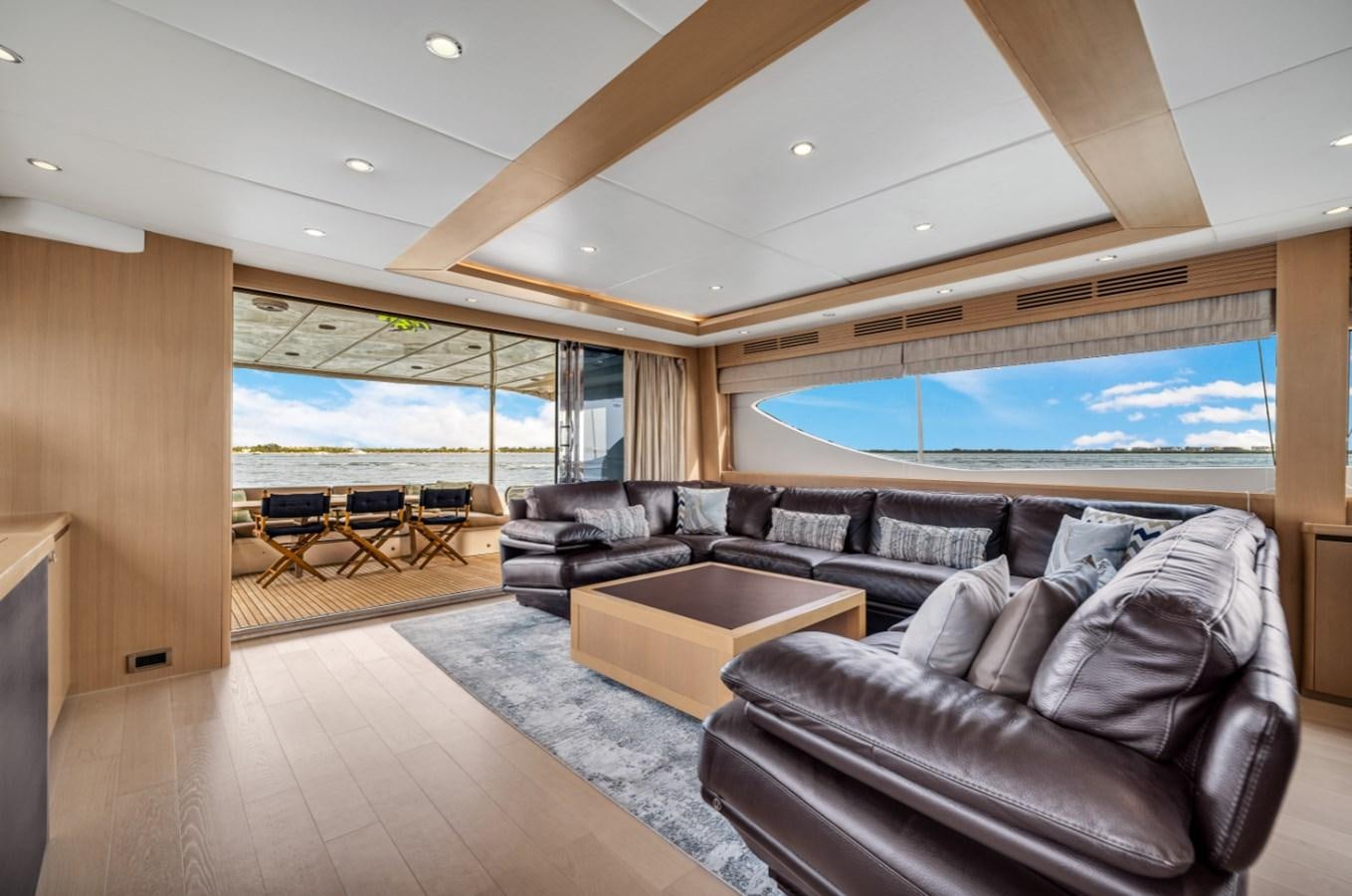 a living room with a large window aboard PRINCESS 85 MY Yacht for Sale