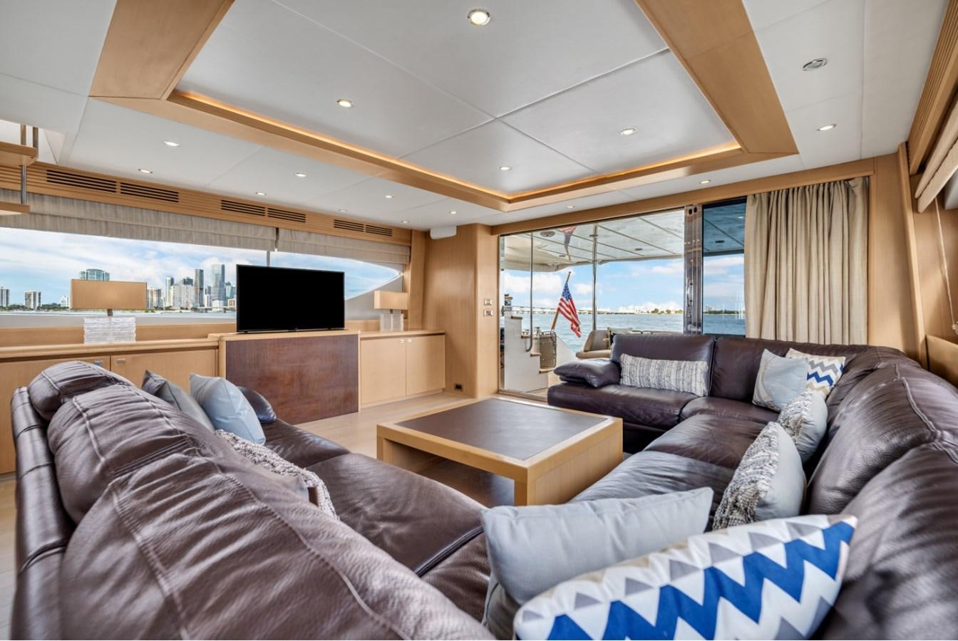 a living room with a couch and a tv aboard PRINCESS 85 MY Yacht for Sale