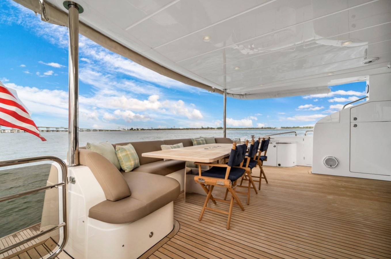 a tent with a table and chairs aboard PRINCESS 85 MY Yacht for Sale