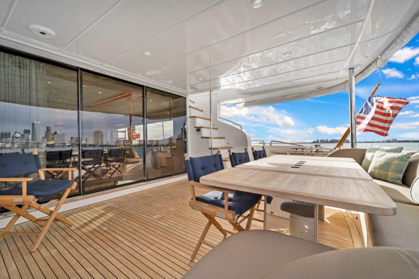 a room with a table and chairs aboard PRINCESS 85 MY Yacht for Sale