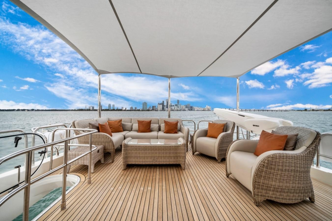 a large white tent with couches and a table and chairs aboard PRINCESS 85 MY Yacht for Sale