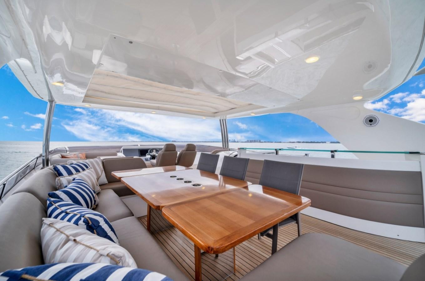 a tent with a table and chairs aboard PRINCESS 85 MY Yacht for Sale