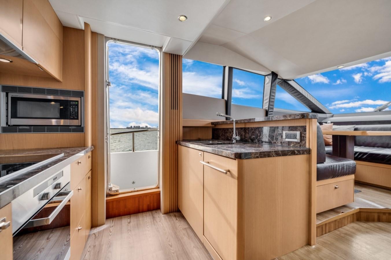 a kitchen with a large window aboard PRINCESS 85 MY Yacht for Sale