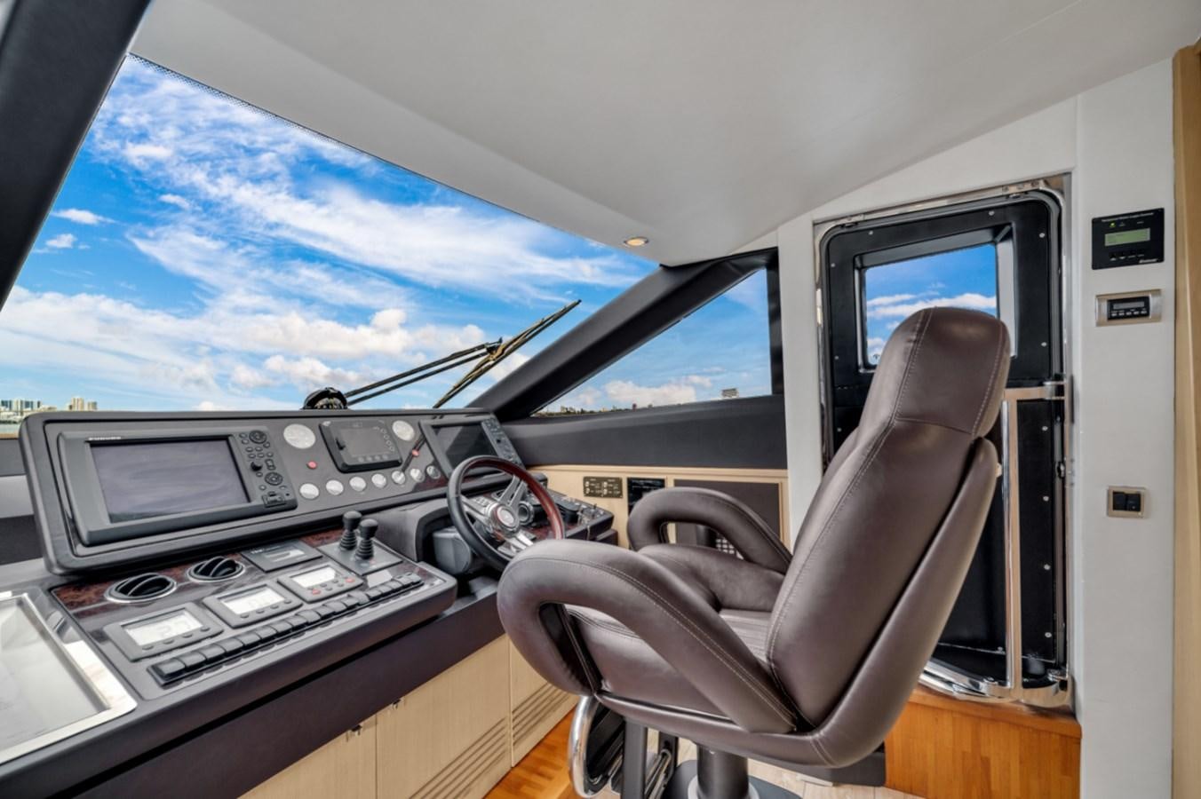 a plane cockpit with a few seats aboard PRINCESS 85 MY Yacht for Sale