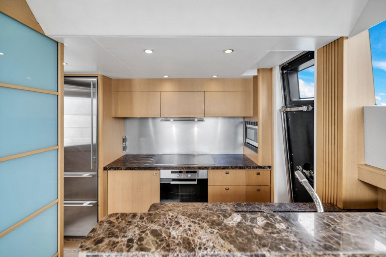 a kitchen with a marble counter top aboard PRINCESS 85 MY Yacht for Sale