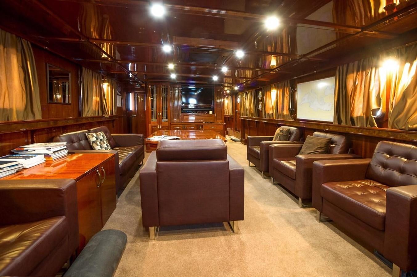 a living room with leather couches aboard ANNA I Yacht for Sale
