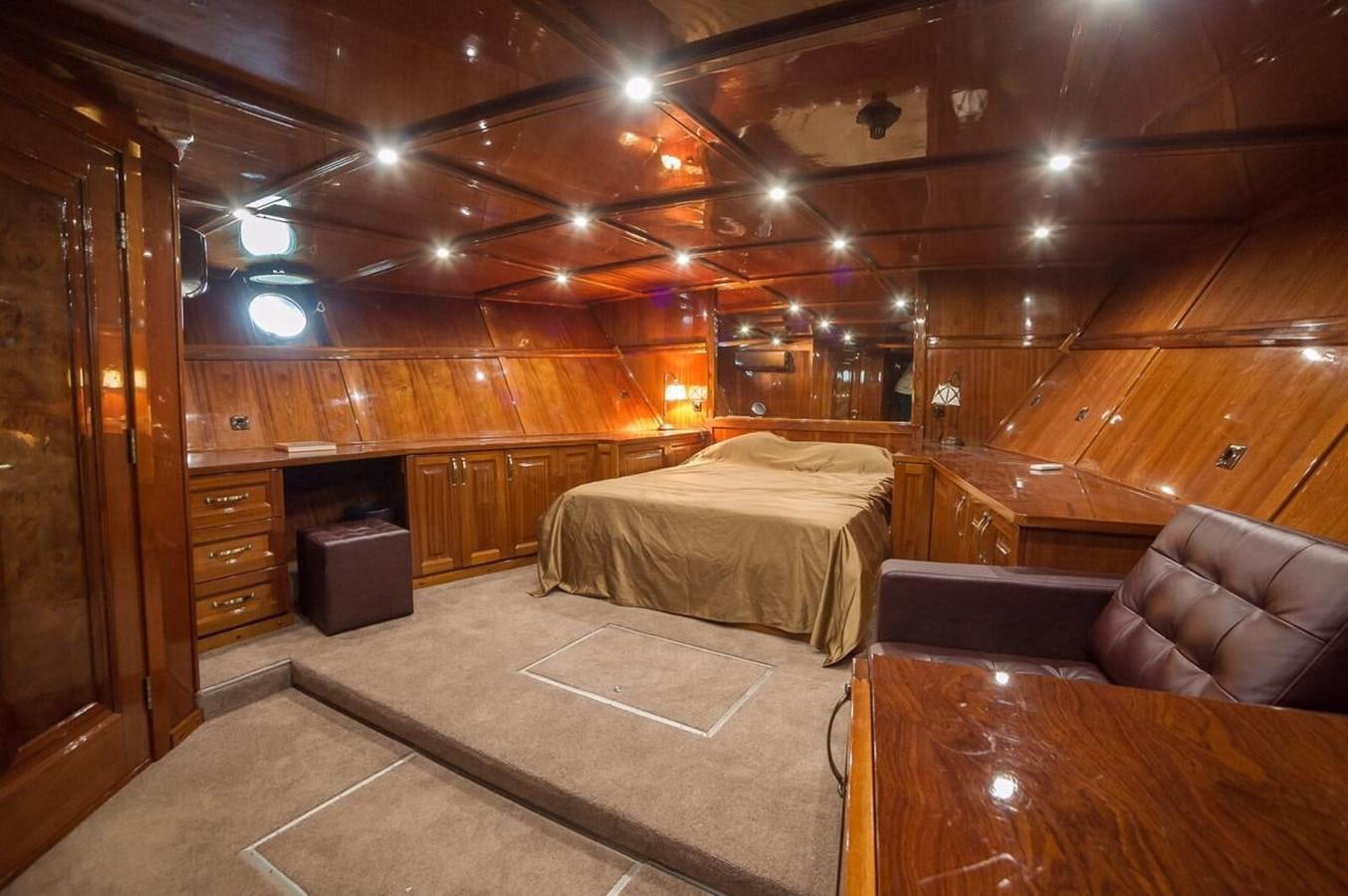 a room with a bed and a couch aboard ANNA I Yacht for Sale