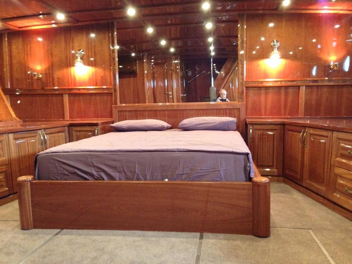 a bed in a wooden room aboard ANNA I Yacht for Sale
