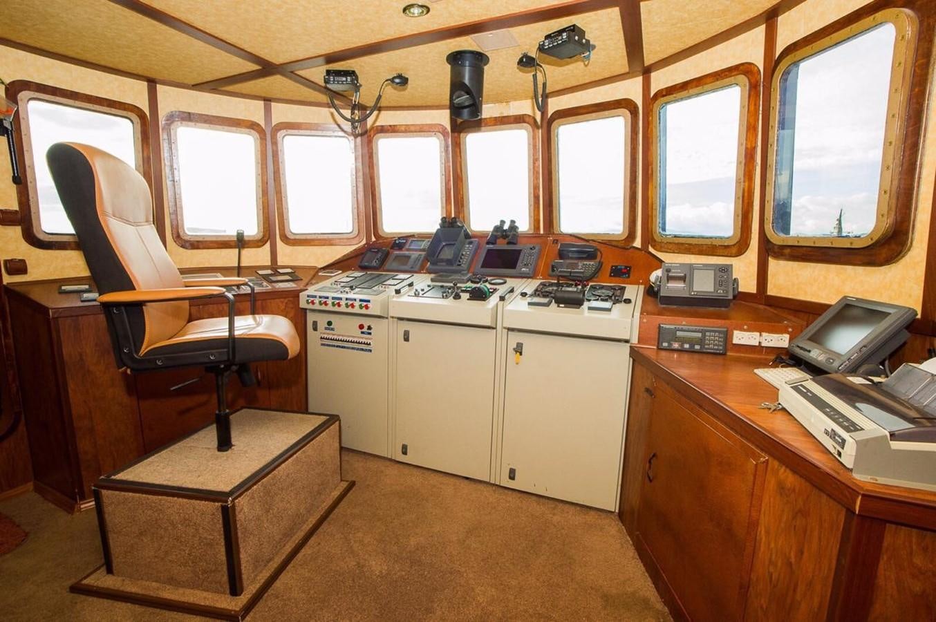 a room with a desk and a chair aboard ANNA I Yacht for Sale