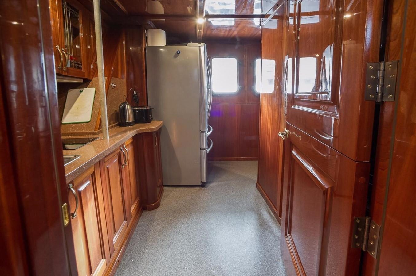 a hallway with a fridge aboard ANNA I Yacht for Sale