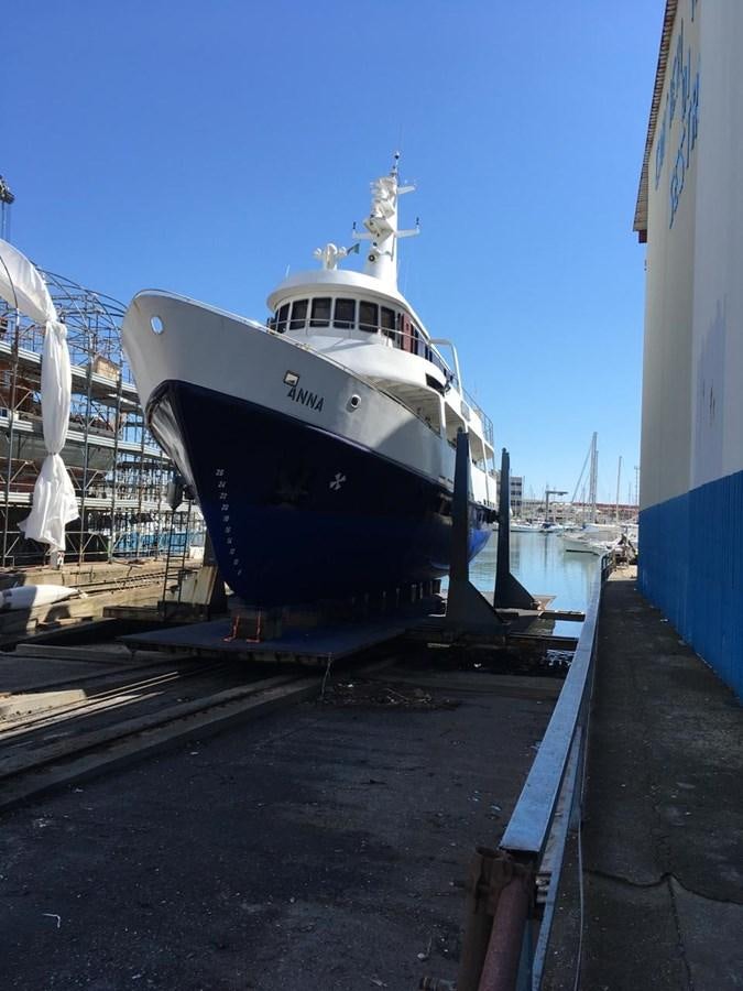 a large white ship docked aboard ANNA I Yacht for Sale