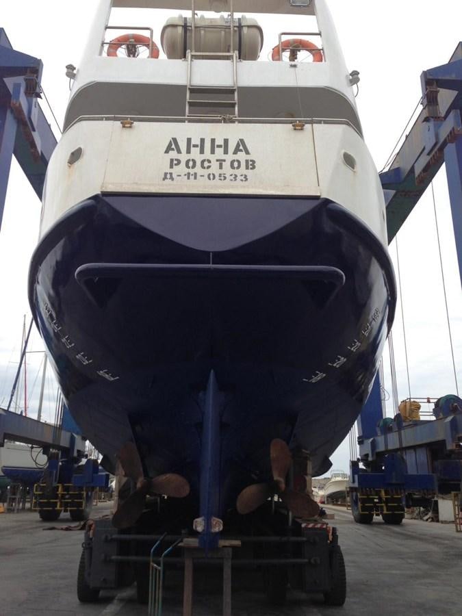 a large white boat with a blue ladder on it aboard ANNA I Yacht for Sale