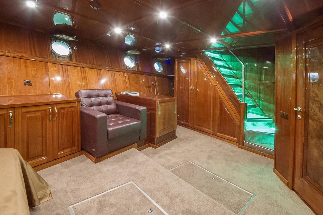 a living room with wood walls aboard ANNA I Yacht for Sale