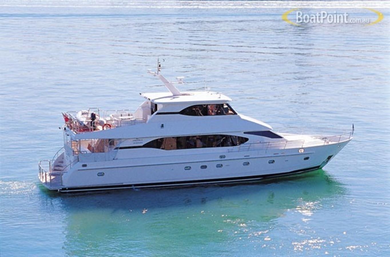 a white boat in the water aboard OCEANOS II Yacht for Sale