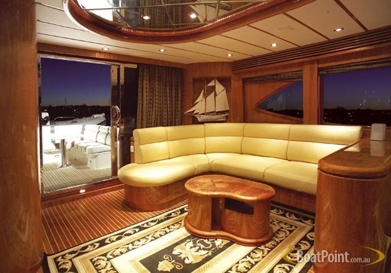 a living room with a large window aboard OCEANOS II Yacht for Sale