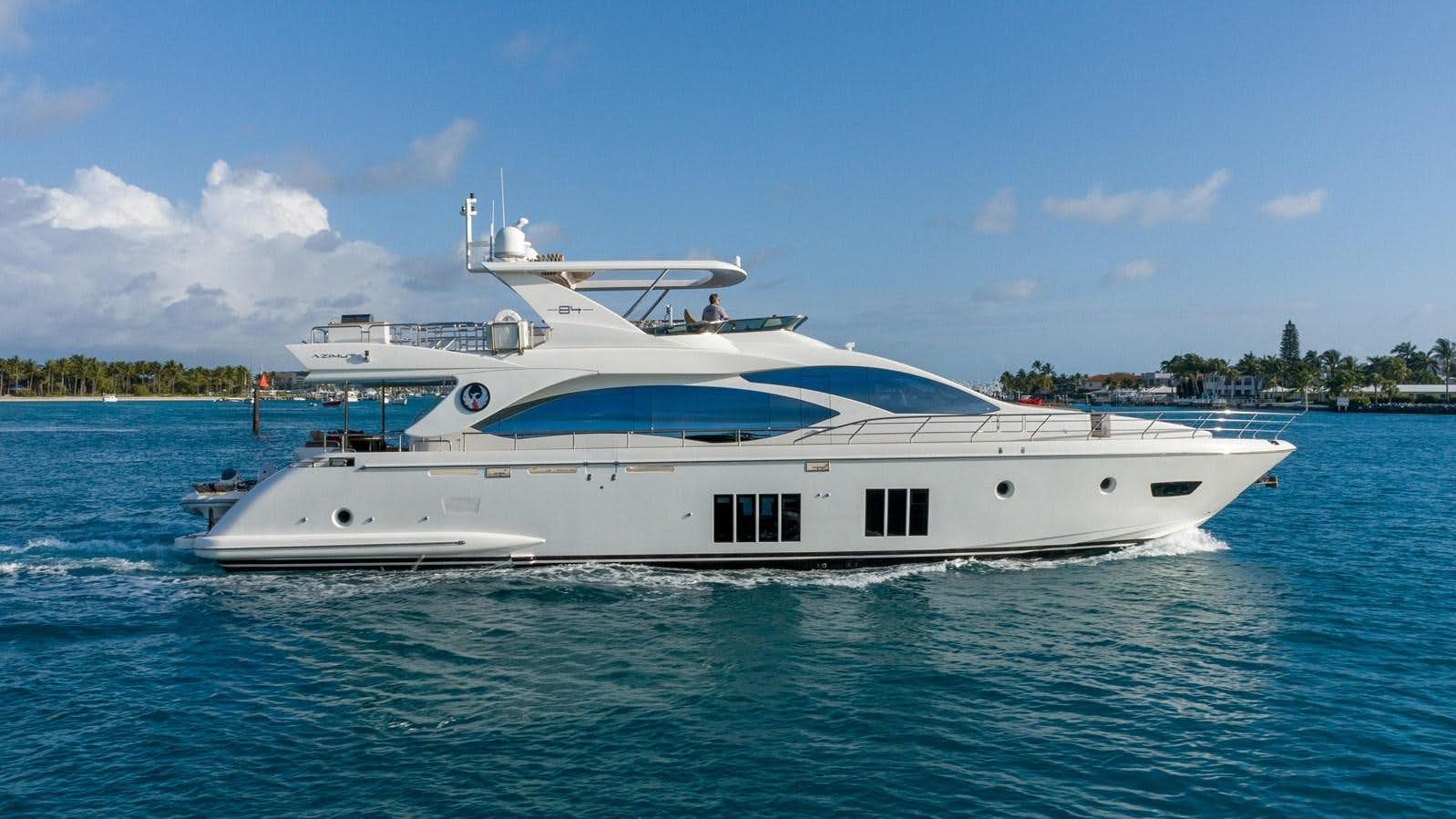 a white yacht on the water aboard PHOENIX Yacht for Sale