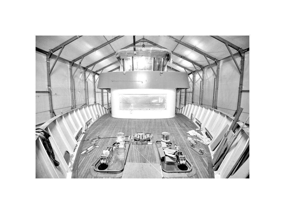 a large room with tables and chairs aboard AUDACE 80 Yacht for Sale