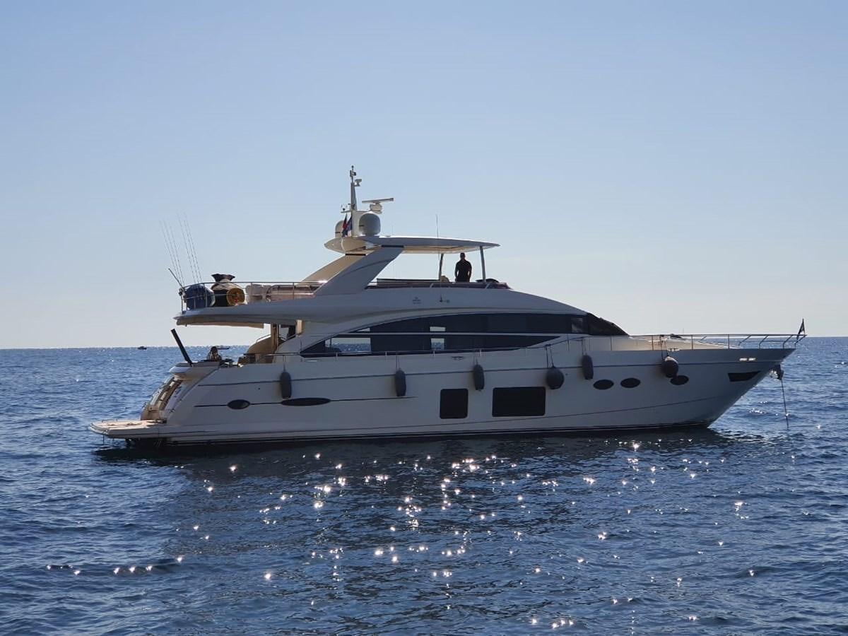 a white boat in the water aboard JUST ANOTHER TOY Yacht for Sale