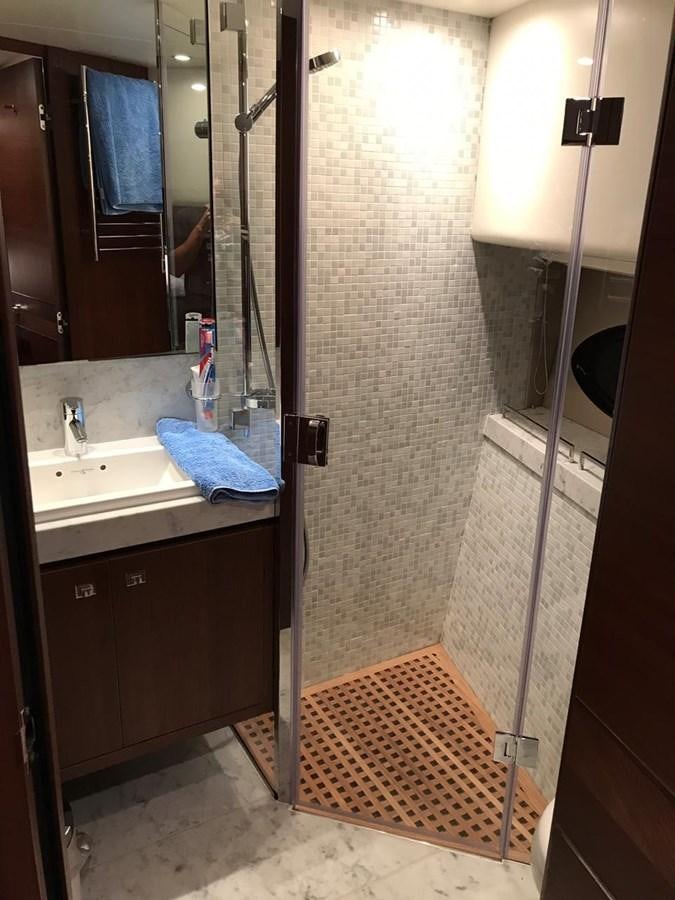 a bathroom with a shower unit and sink aboard JUST ANOTHER TOY Yacht for Sale