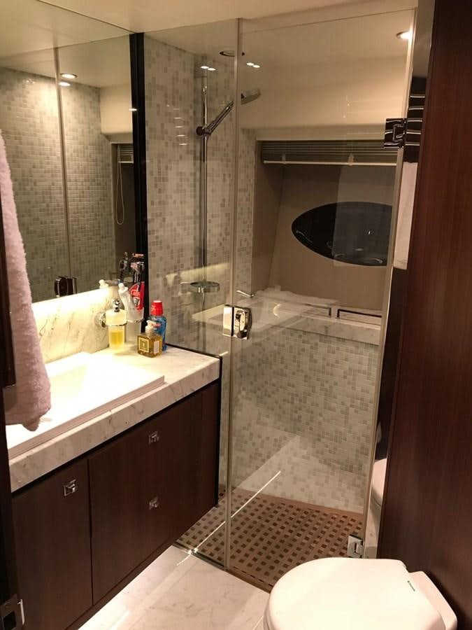 a bathroom with a shower unit and sink aboard JUST ANOTHER TOY Yacht for Sale