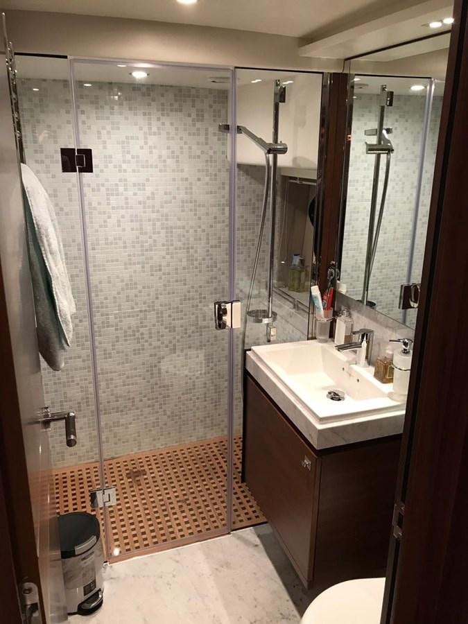 a bathroom with a shower unit and sink aboard JUST ANOTHER TOY Yacht for Sale