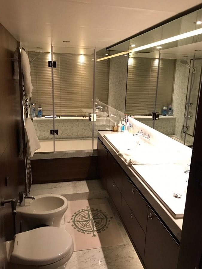 a bathroom with a large mirror aboard JUST ANOTHER TOY Yacht for Sale