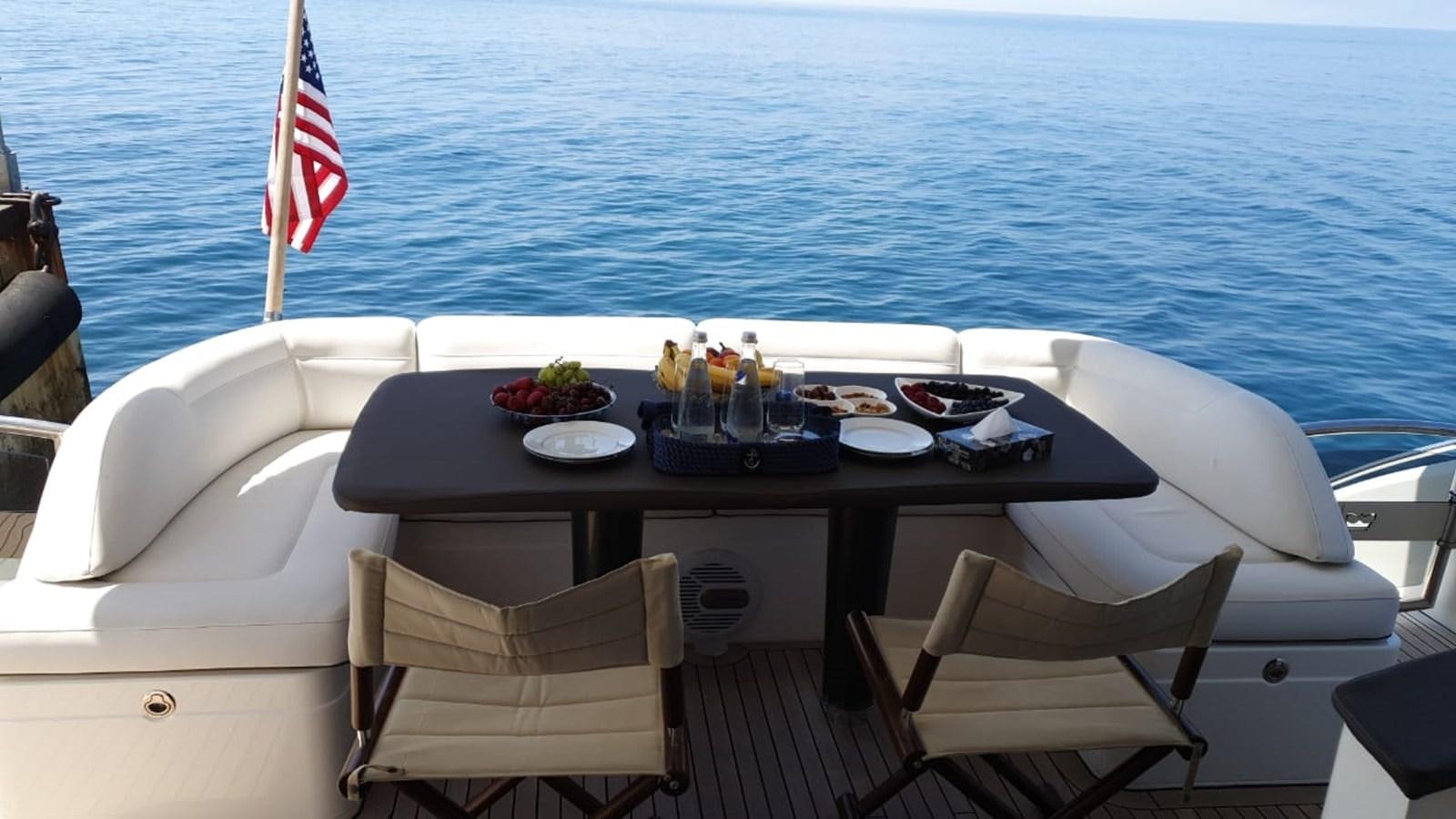 a table with food on it aboard JUST ANOTHER TOY Yacht for Sale