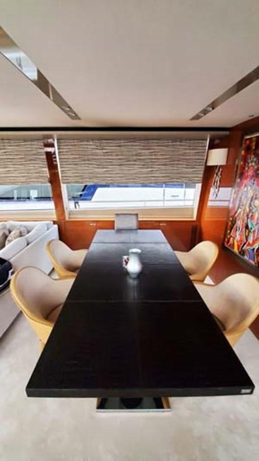 a table with a glass on it aboard AQUA CHAMELEON Yacht for Sale