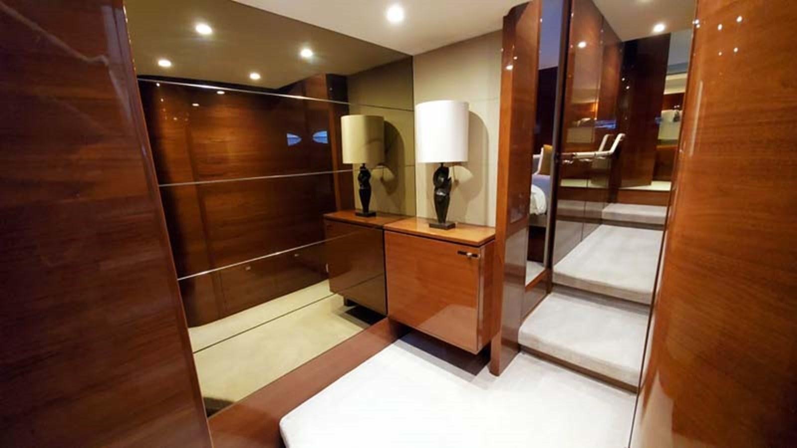 a room with a mirror and a sink aboard AQUA CHAMELEON Yacht for Sale